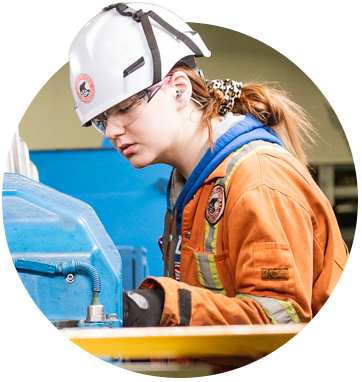 Female Marine Engineer Inspecting Equipment